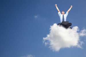 7562581 - young businessman with computer sitting on the cloud