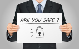 43587628 - close-up look at businessman holding are you safe poster