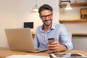 Happy man using smartphone